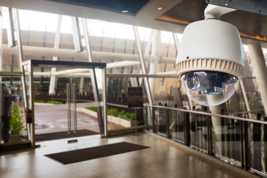 A surveillance camera overlooking the lobby of a building.